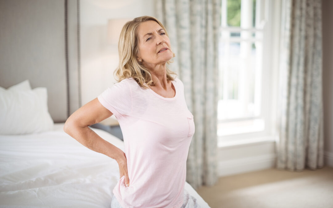Older woman experiencing lower back pain