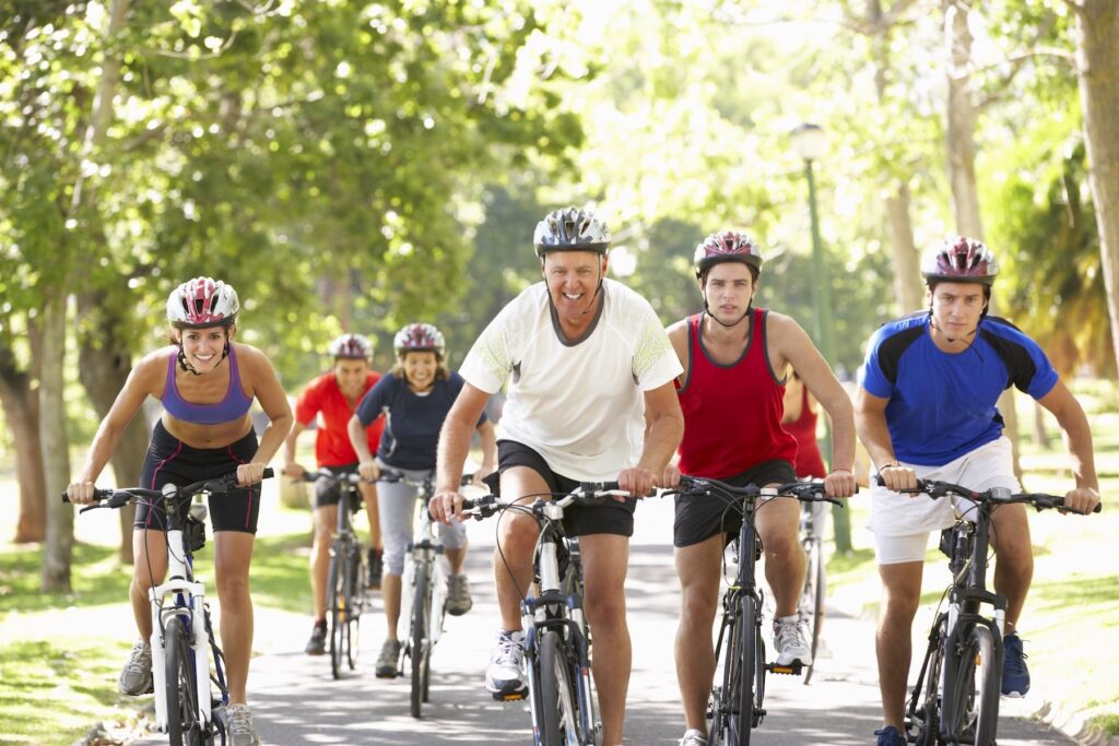 Group of people biking in the sun